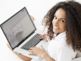 Original source: https://secureacom.com/wp-content/uploads/2017/10/African-American-woman-on-computer-e1414453394466.jpg Creating WordPress Websites