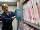 Original source: https://upload.wikimedia.org/wikipedia/commons/thumb/2/2d/US_Navy_090123-N-9760Z-004_Hospital_Corpsman_2nd_Class_Jennifer_Ross_files_medical_records_aboard_the_aircraft_carrier_USS_Nimitz_%28CVN_68%29.jpg/1280px-US_Navy_090123-N-9760Z-004_Hospital_Corpsma Medical Coding with CPC Certification (Training Application)